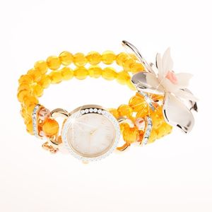 Zegarek z przejrzystych żółtych koralików, cyferblat z cyrkoniami, duży kwiat